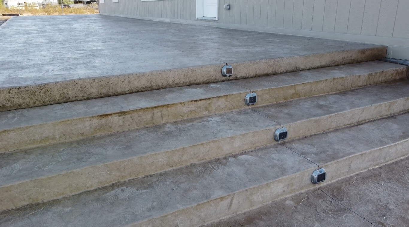 Professional concrete steps installation showing precision grading in Pomona